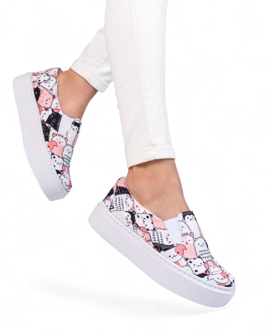 Sneakers with a cat pattern worn by a person on a white background